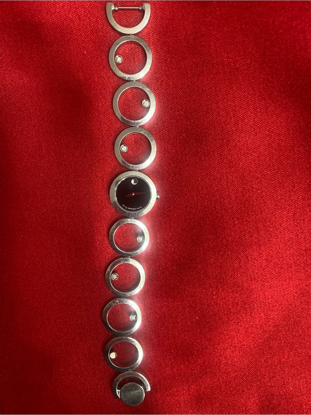 Movado Silver and Black Circle Link Bracelet Watch with diamonds.